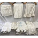 A collection of 7 Victorian petticoats with decorative hems and boarders of lace, ribbon, broderie