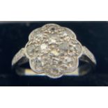 An unmarked white metal ring set with diamonds size L. Weight 3.5gms.Condition ReportGood