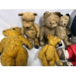 A collection of 9 Teddy Bears, play worn plush fur, one straw filled. Smallest 28cms h, largest