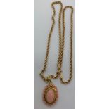 A coral cluster pendant set in 18ct gold on an 18ct gold chain. 45cms l, total weight 7.3gms.