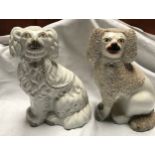 Two Staffordshire pottery Spaniel dogs, 25cms h.Condition ReportOne with chips to right foot, one