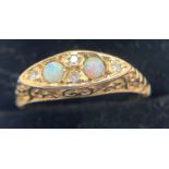 A 9ct gold opal and diamond set ring, size M, 2.6gms weight.