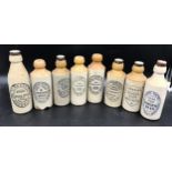 A collection of 8 stoneware ginger beer bottles from the East Yorkshire area to include 5