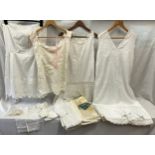 A collection of Victorian women's cotton undergarments and baby/dolls clothes to include 3 white