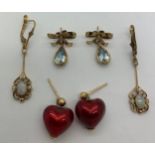 Three pairs of earrings all 9ct yellow gold, one set with opals and seed pearl, one aquamarine