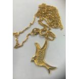 A gold dove pendant set with clear stone on chain marked 21k. Total weight 2.4gms.Condition