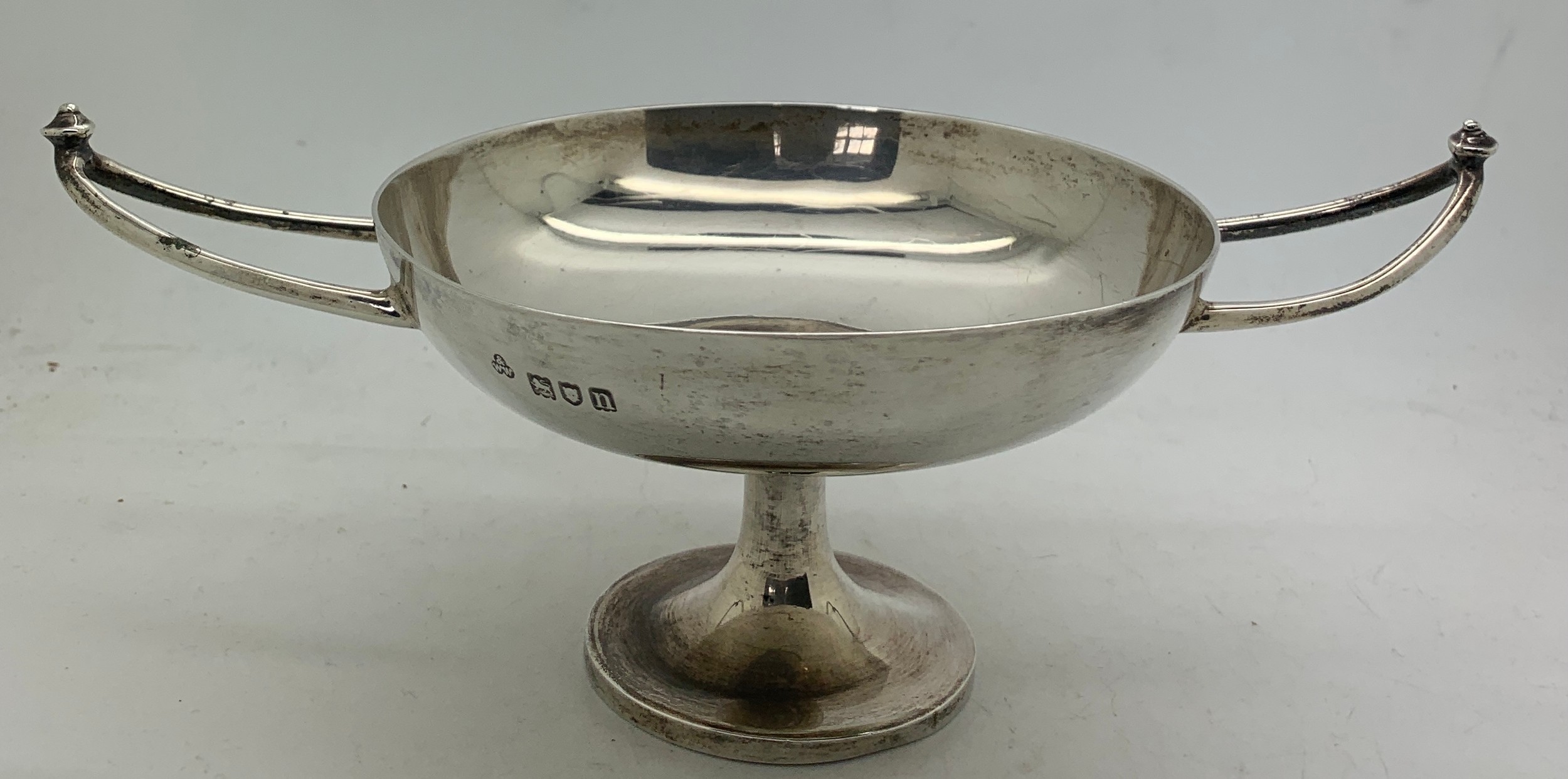 Twin handled silver dish 19cms x 11cms x cms h. London 1908, maker Wakely and Wheeler.Condition