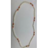 A pearl and coral necklace 44cms l, clasp marked 14k.Condition ReportGood condition.