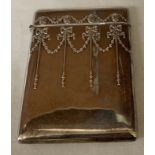 Silver card case with bow and garland decoration Birmingham 1907 maker Boots Pure Drug Company.
