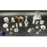 A collection of mainly Swarovski crystal glass ornaments. 23 in total. 11 with faults.Condition