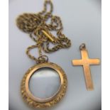 A 9ct gold glazed pendant on unmarked yellow metal chain together with a crucifix marked 9ct.