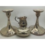 Hallmarked silver to include part candlesticks (weighted bases) 14cms h, oval snuff box and a mug.