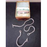 A chain necklace and matching bracelet marked .925 and a silver backed hair brush and comb in