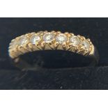 9ct gold ring set with clear stones, size K, 1.4gms weight.Condition ReportGood condition.