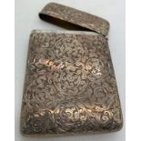 A silver card case Birmingham 1993 with foliate scroll engraving. Initialled to front. 69gms.