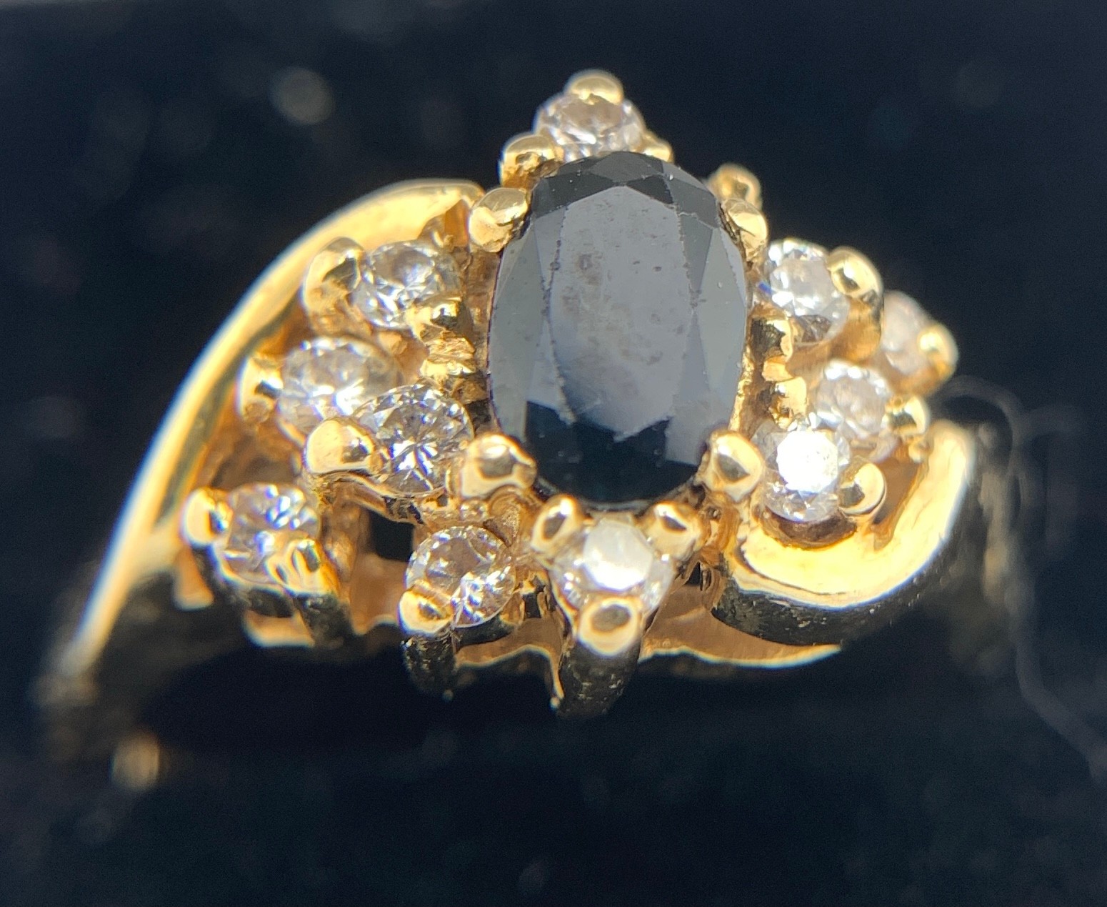 A sapphire and diamond ring marked 18ct. Size K/L. Weight 4.4gms.Condition ReportGood condition.