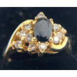 A sapphire and diamond ring marked 18ct. Size K/L. Weight 4.4gms.Condition ReportGood condition.
