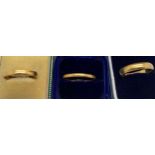 Three 22ct gold wedding bands. Sizes S,T and U. 9.8gmsCondition ReportGood condition.