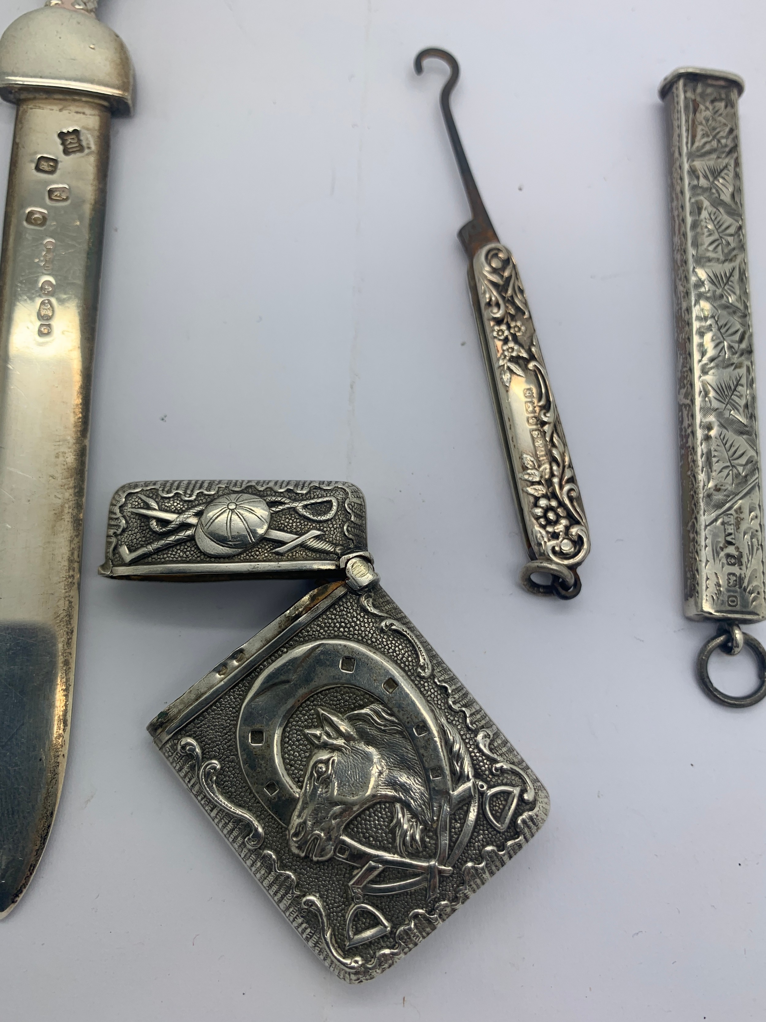 Four various silver and white metal items to include a paperknife, a button hook Birmingham 1901, - Image 4 of 4