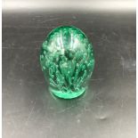 A Victorian green glass "Dump" 13cms h.Condition ReportSurface scratches otherwise fair condition.