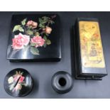 A selection of black lacquered ware items to include a 2 drawer Clark & Co Anchor sewing cottons box