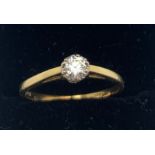 A solitaire diamond ring set in 18ct yellow gold. Size P/Q. Weight 2.4gms.Condition ReportSlight