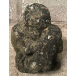 A stone figure of a man and child. Approx 35cms h x 30cms w.Condition ReportHeavily weathered, chips