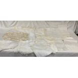 A selection of crocheted linen to include bolsters, small table cloths, pillow cases etc together