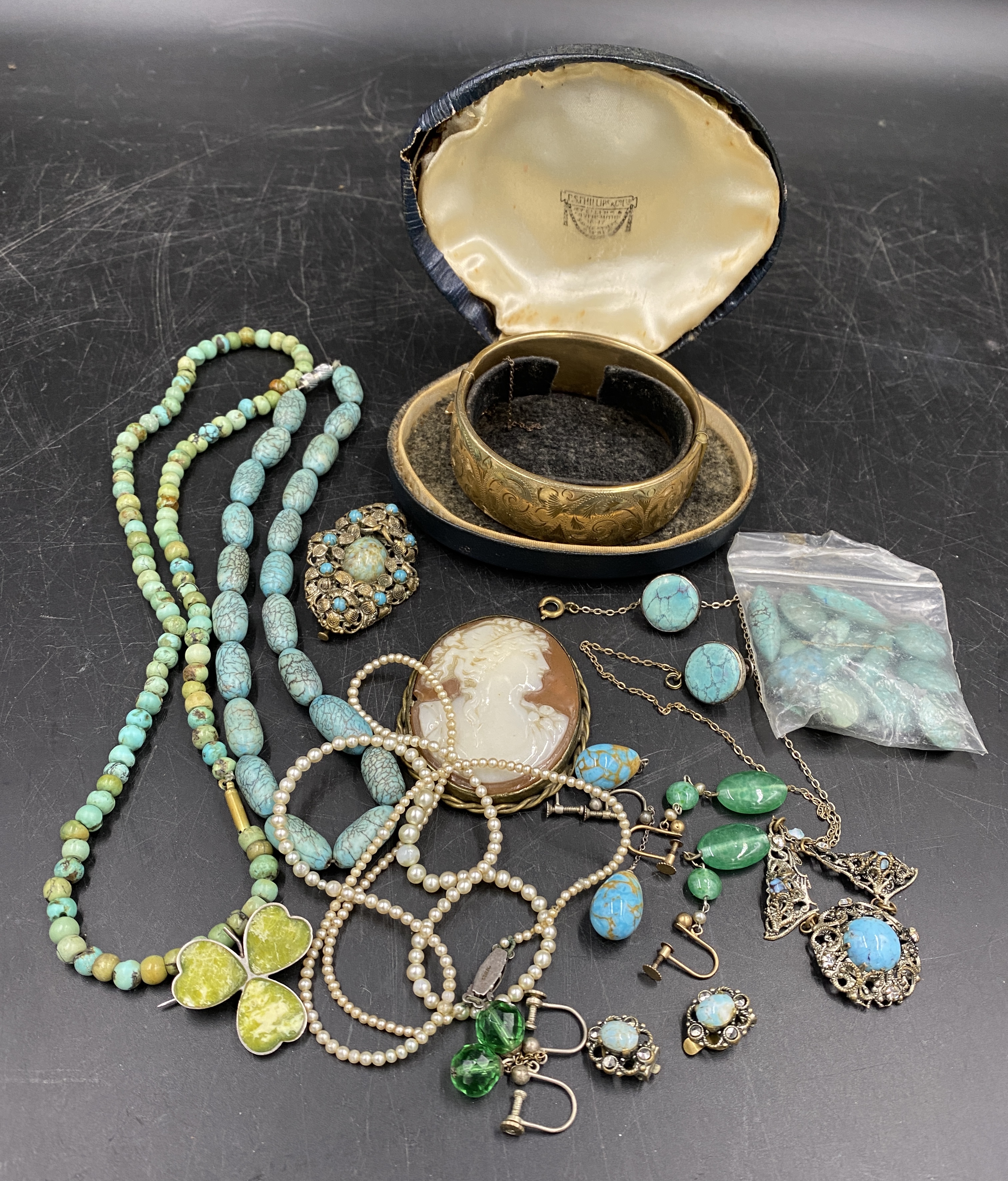 Vintage jewellery to include two turquoise bead necklaces, hallmarked silver clover brooch with gree