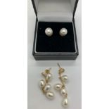 Two pairs of pearl earrings, one pair of drops with 4 pearls on each in yellow metal marked 14k