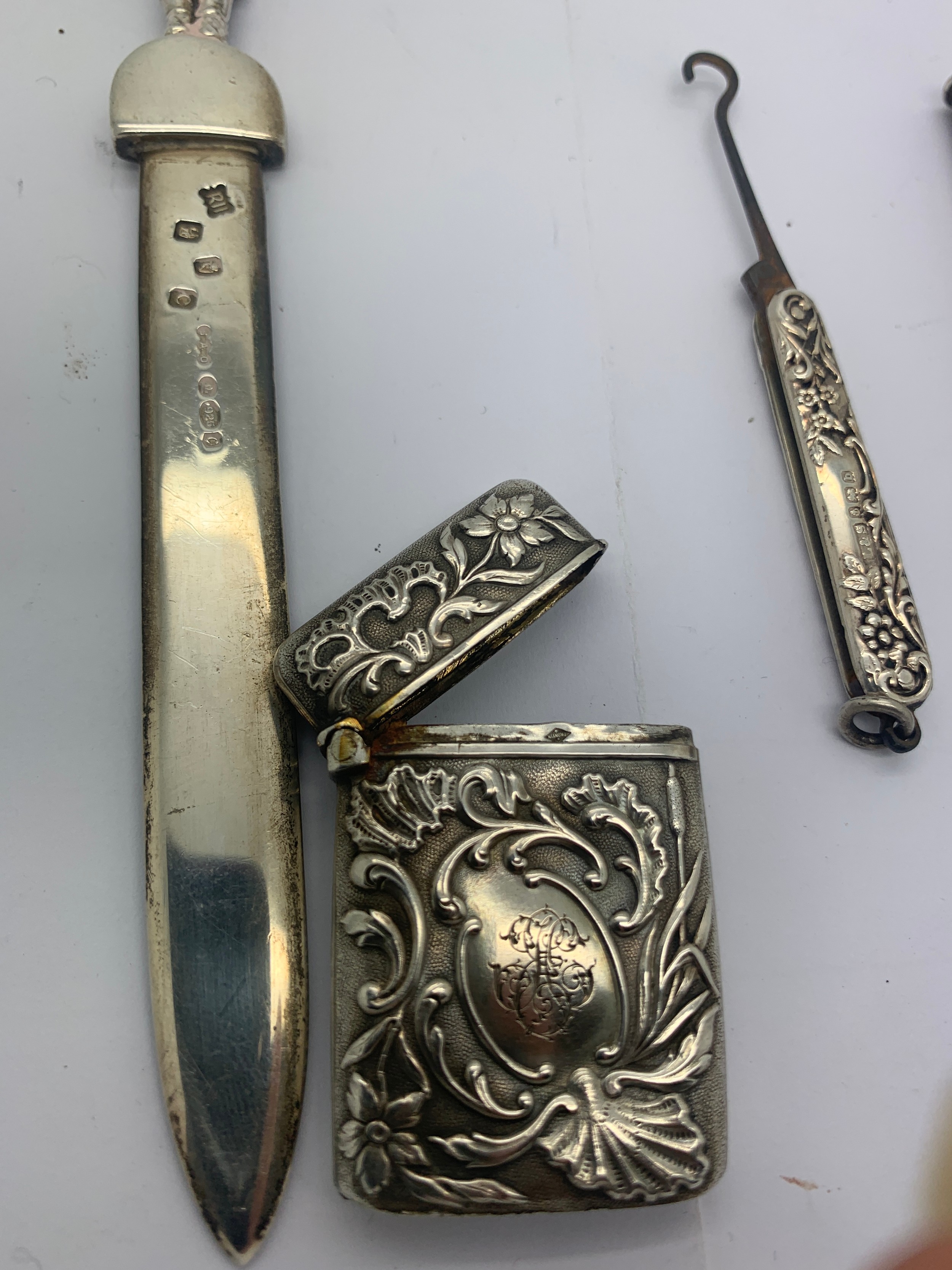 Four various silver and white metal items to include a paperknife, a button hook Birmingham 1901, - Image 3 of 4