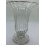 A jelly glass with bell bowl closely wrythen moulded and conical foot with pontil mark. Circa