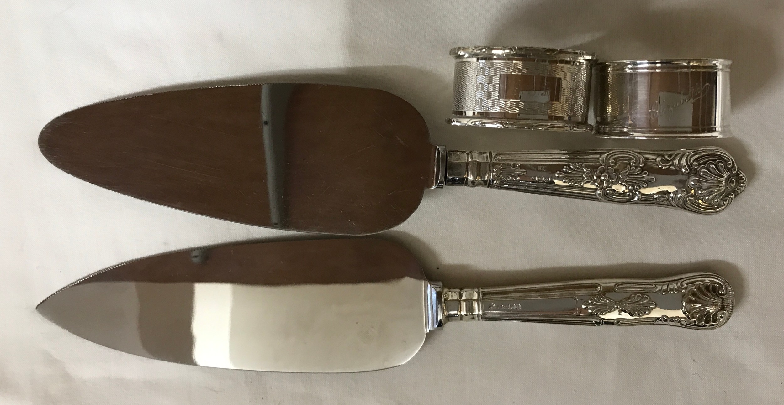 A selection of silver to include two cake knifes with silver handles, both Sheffield 1960 and 1977