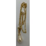 A single pearl drop pendant on 18ct gold chain. Chain 44cms l. Total weight 2.8gms.Condition