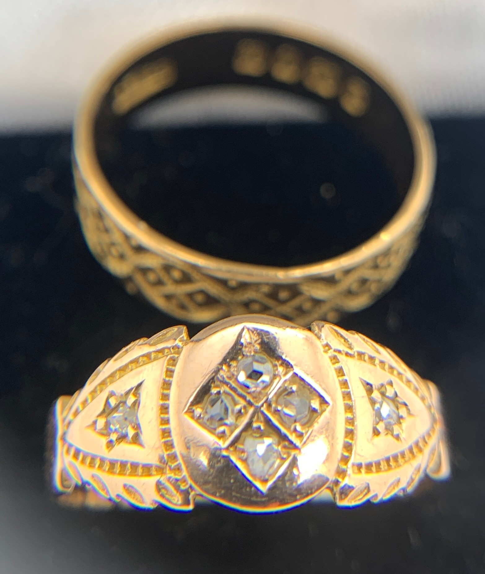 Two rings, one 18ct wedding band, the other diamond set on yellow metal, marks rubbed. Total