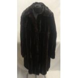 A mid length Canadian squirrel coat with label "fashioned exclusively from skins produced by
