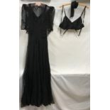 A long black silk chiffon evening dress with double sided crepe lining and matching short sleeved