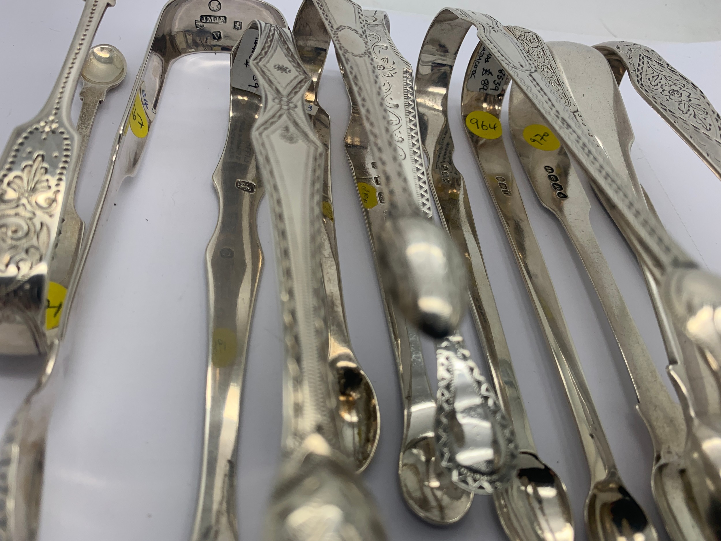 A collection of 15 good quality silver sugar tongs to include: Stephen Adams London 1793 14cms, - Image 5 of 16
