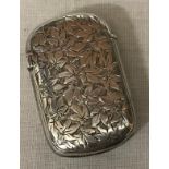 A silver vesta case with leaf decoration and vacant cartouche, GU Birmingham 1894, 19gms.Condition