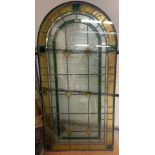 A leaded stained glass arched top window panel. 169 x 84cm.Condition ReportGood condition.