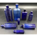 A blue glass poison bottle collection, tallest 18.5cms h, smallest Teasdale Chlorodyne bottle 9cms