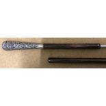 Sword stick walking cane with embossed white metal (possibly silver) handle, 85cms l.Condition