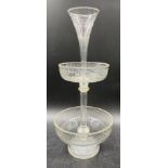 An early 19thC glass sweetmeat dish with trumpet vase to top and Greek key engraving. 39cm h.