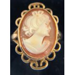 A carved shell cameo set in a 9ct yellow gold mount. Size N. Weight 4.2gms.