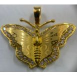 A gold butterfly marked 21K set with white stones. Weight 5.6gms. Approx 3.5cms w.Condition