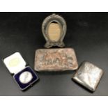 A silver cigarette box Birmingham WHS 191 88gms, a silver swimming medal 25gms with case together