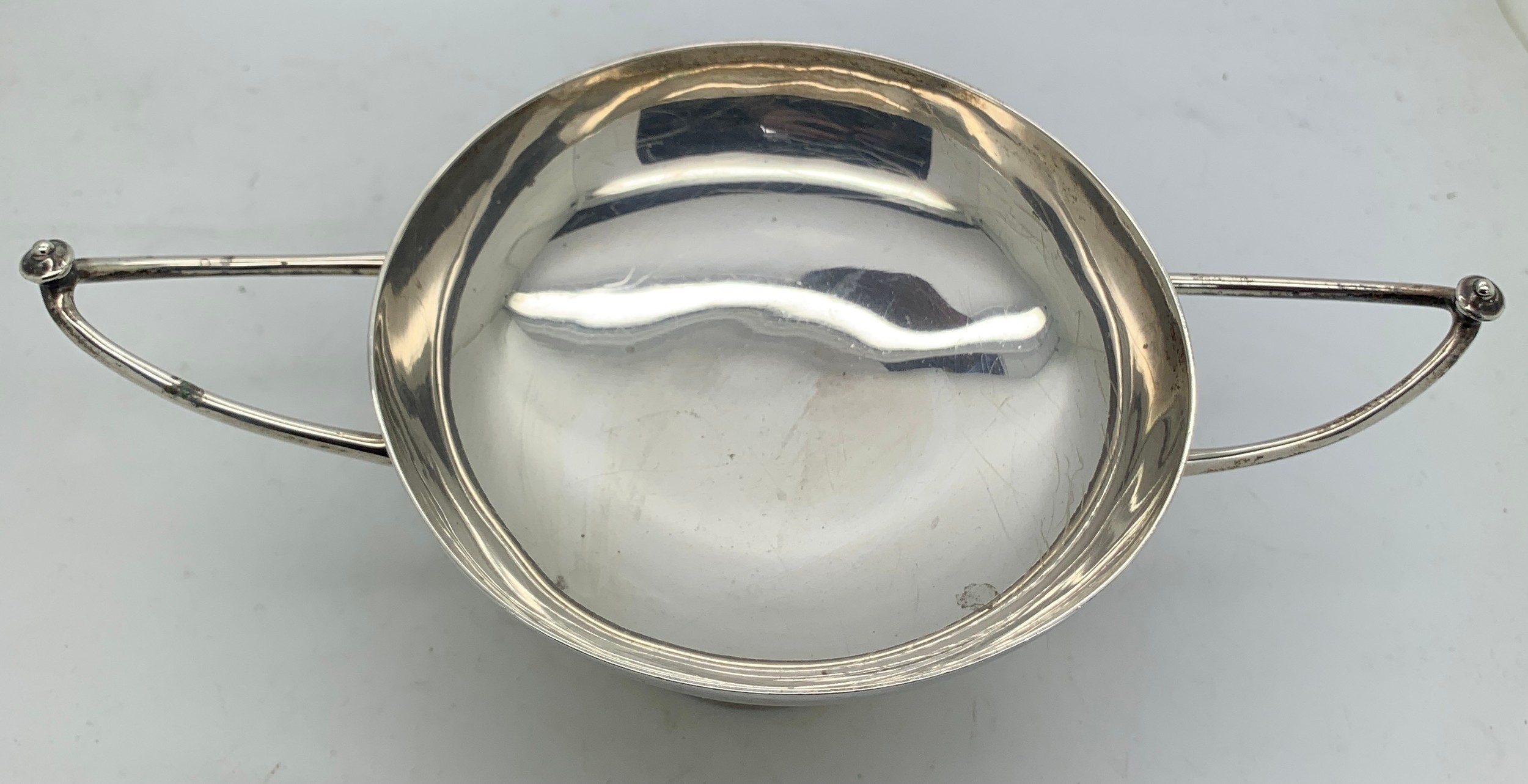 Twin handled silver dish 19cms x 11cms x cms h. London 1908, maker Wakely and Wheeler.Condition - Image 2 of 2