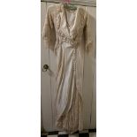 An early 20thC silk and lace wedding gown of exceptional design and quality.Condition ReportVery