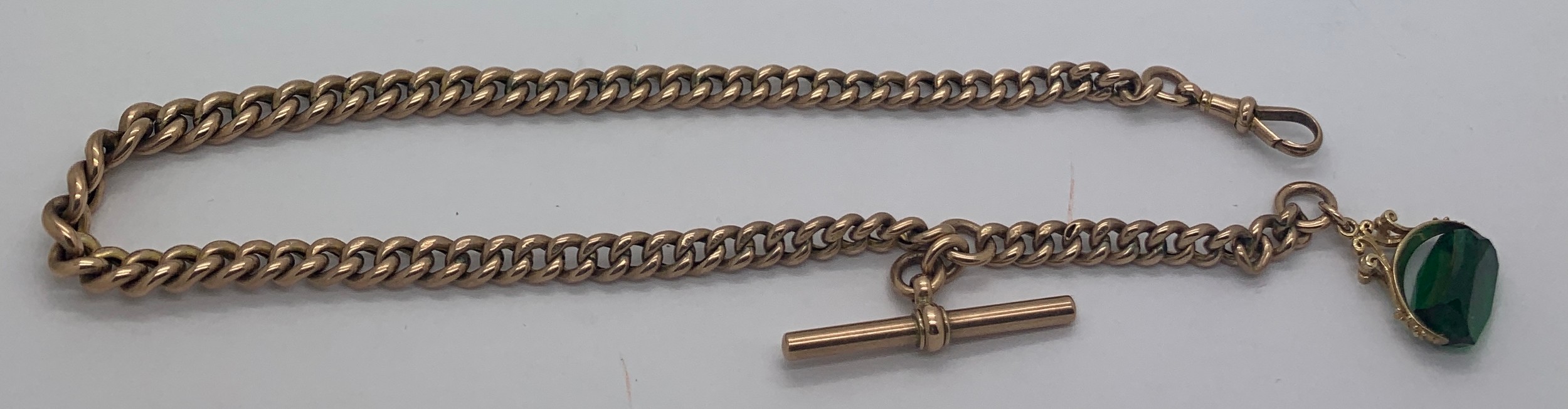 A 9ct gold watch chain and fob 33cms l. Total weight 17.9gms.Condition ReportGood condition.