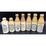 A collection of seven stoneware ginger beer bottles, Hull makers, one Binnngtons Star Works, 2 x T